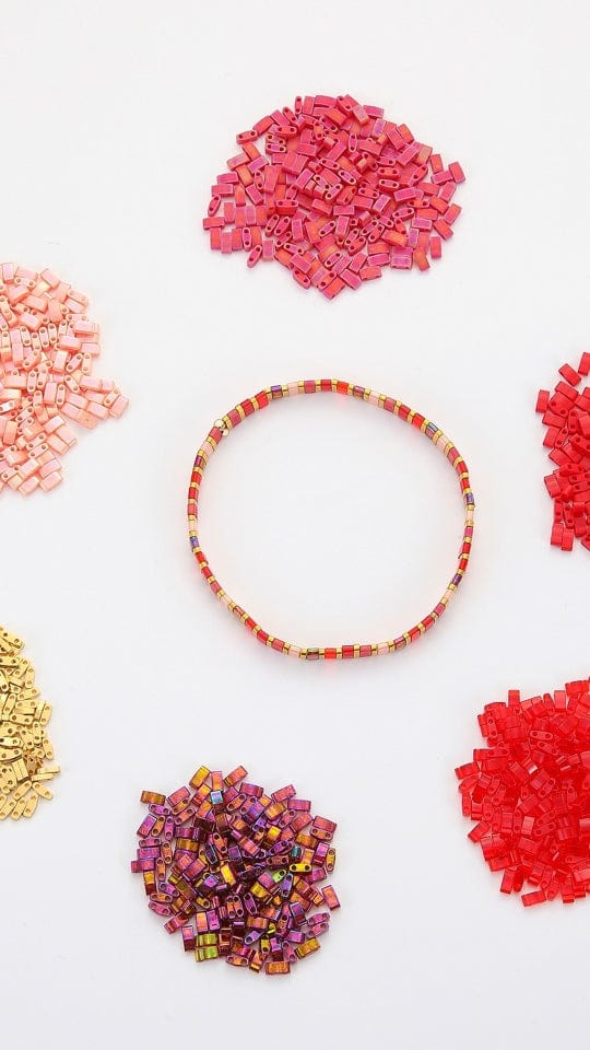 Threading beads by hand with a needle